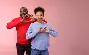 LP-charming-joyful-caring-young-african-american-family-man-woman-siblings-smiling-broadly-show-heart-gestures-grinning-express-love-empathy-positivity-two-loyal-friends-cherish-friendship